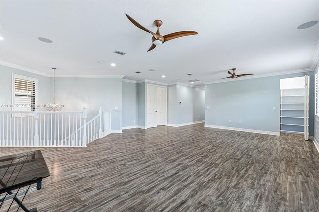 spare room with hardwood / wood-style flooring, ornamental molding, and ceiling fan