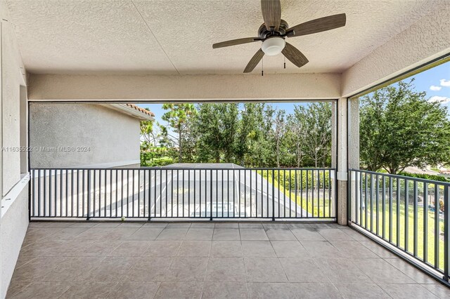 view of patio / terrace featuring a balcony and ceiling fan