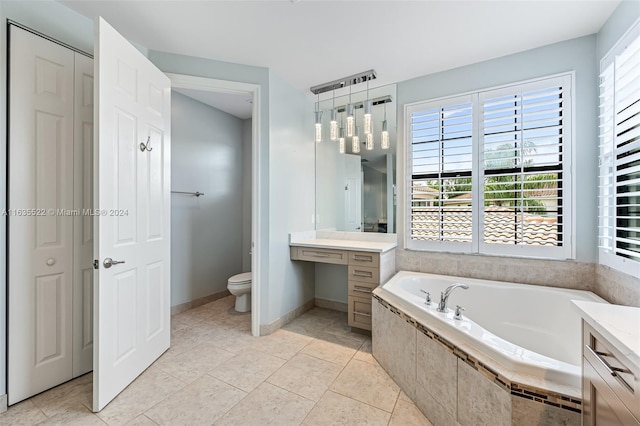 bathroom featuring tile patterned flooring, vanity, and plenty of natural light