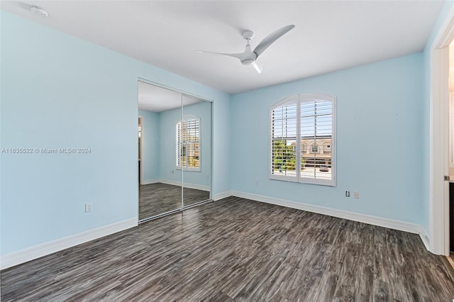 spare room with ceiling fan and dark hardwood / wood-style flooring