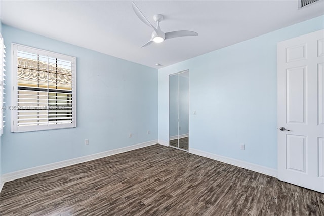 unfurnished room with ceiling fan and wood-type flooring