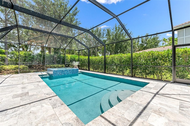 view of swimming pool featuring an in ground hot tub, glass enclosure, and a patio area