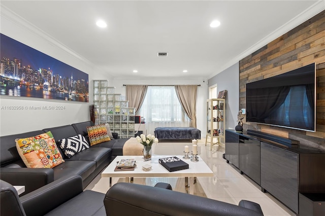 living room featuring light tile patterned flooring and crown molding