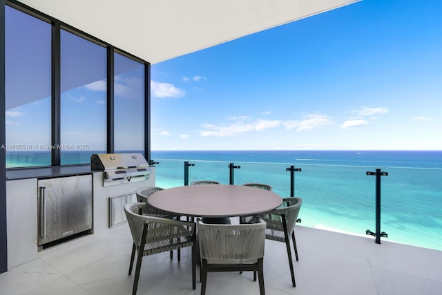 17141 Collins Ave Unit 2501, Sunny Isles Beach, FL 33160 - balcony with grilling area, an outdoor kitchen, a water view, and a beach view