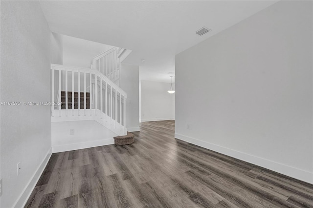 spare room featuring wood-type flooring