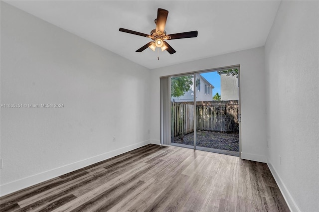 unfurnished room with ceiling fan and hardwood / wood-style flooring