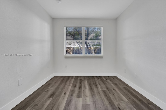 empty room with wood-type flooring