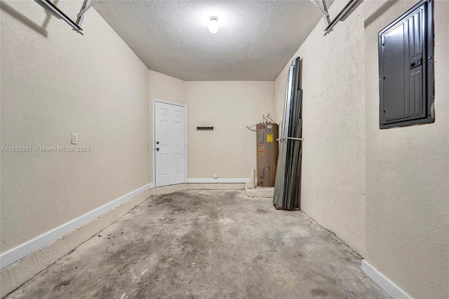 garage with electric panel and water heater