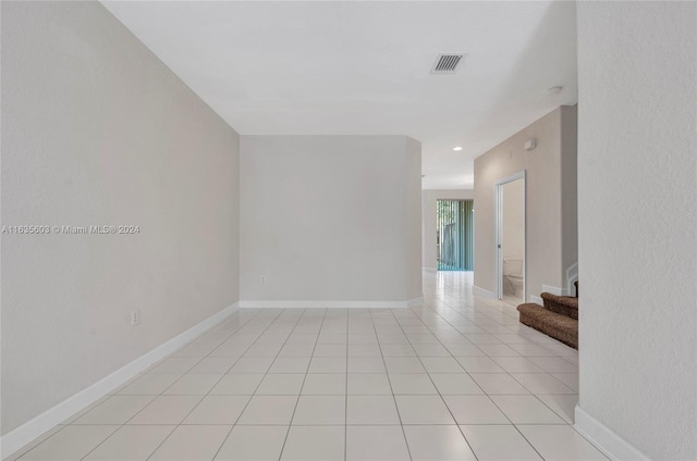 spare room with light tile patterned floors