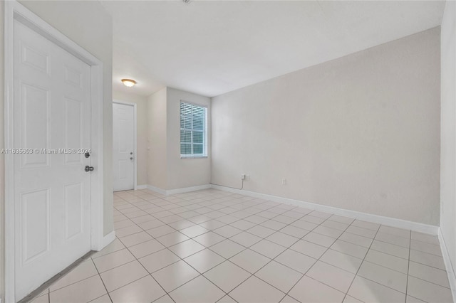 spare room with light tile patterned floors