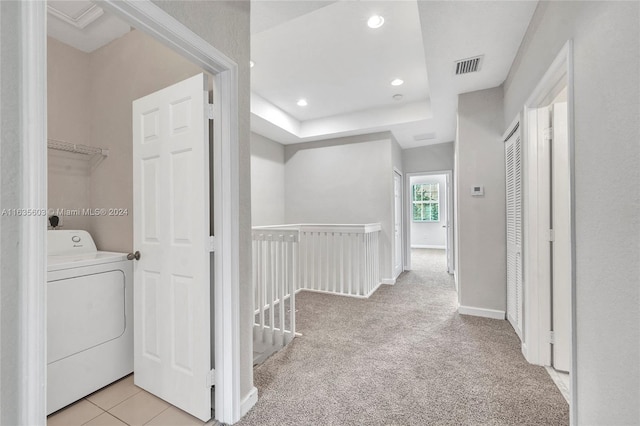 laundry area featuring washer / dryer and light colored carpet