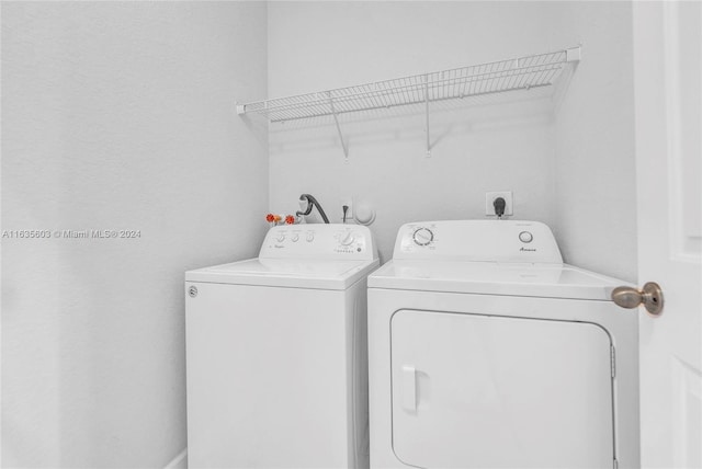 laundry area with separate washer and dryer