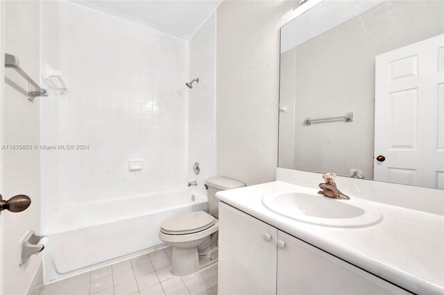 full bathroom with bathing tub / shower combination, vanity, tile patterned flooring, and toilet