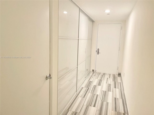 hallway with light tile patterned floors