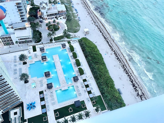 aerial view featuring a view of the beach and a water view