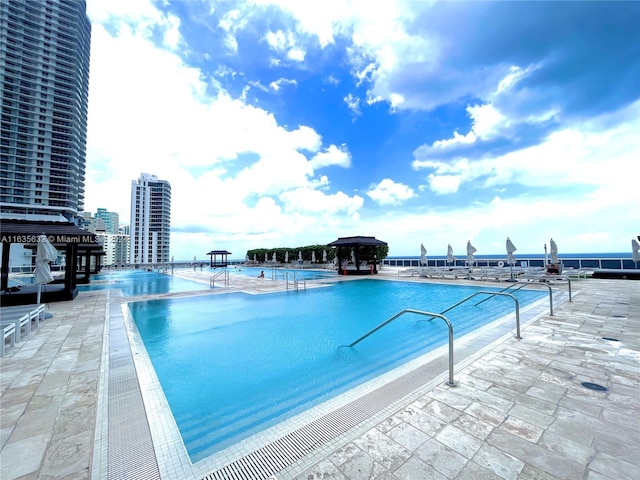 view of swimming pool with a patio area