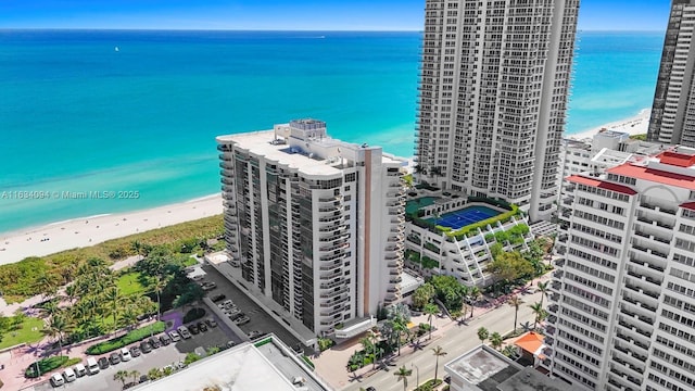 birds eye view of property with a city view, a beach view, and a water view