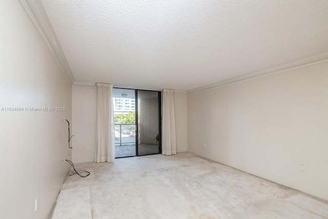 empty room with a textured ceiling and crown molding