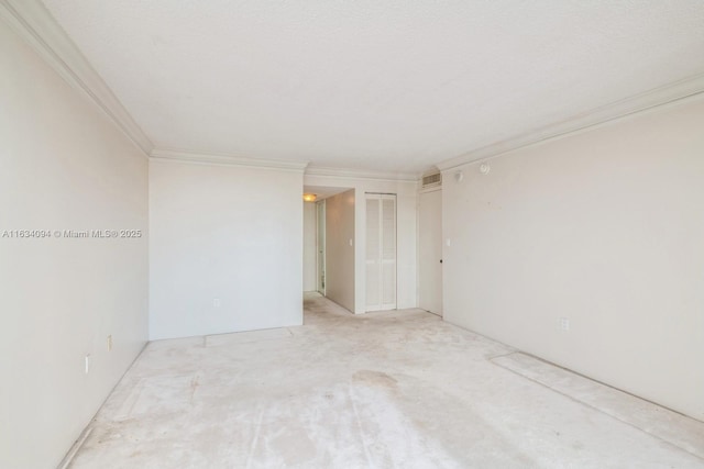 empty room with visible vents and ornamental molding