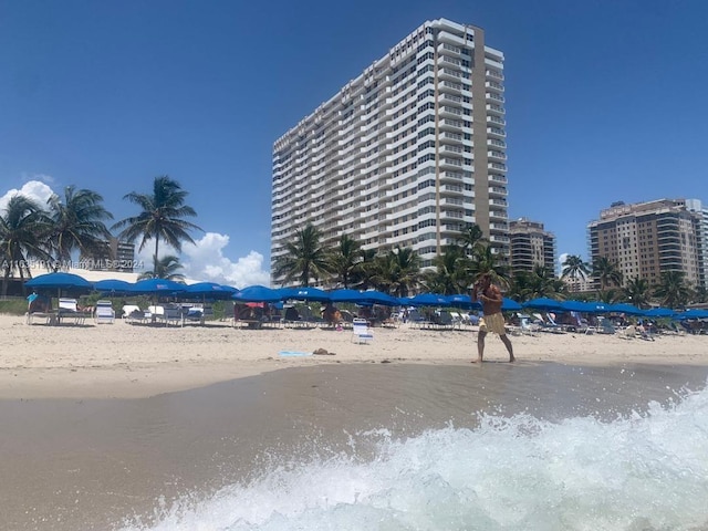 view of property with a beach view