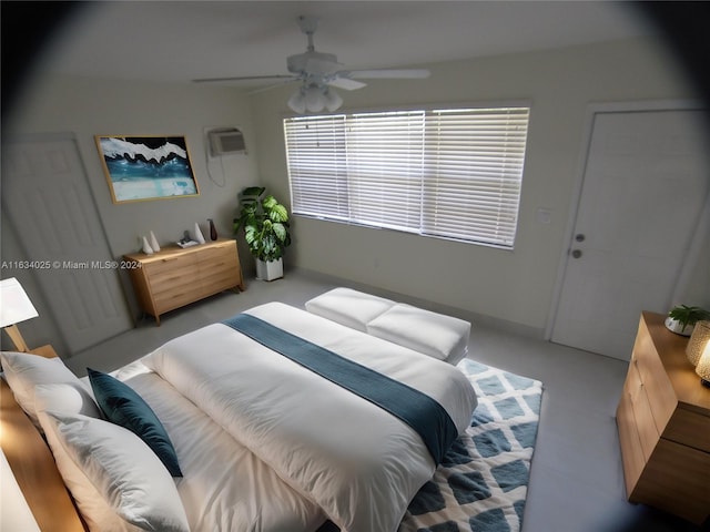 bedroom featuring ceiling fan, carpet, and an AC wall unit