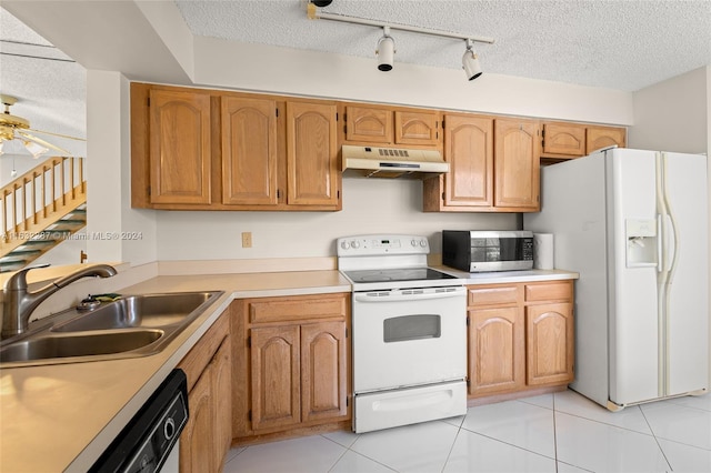 kitchen with rail lighting, white appliances, a textured ceiling, ceiling fan, and sink