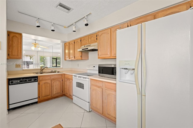 kitchen featuring track lighting, white appliances, sink, a textured ceiling, and ceiling fan