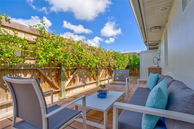 view of patio / terrace with fence and an outdoor hangout area