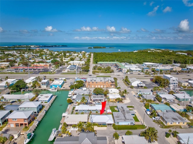 bird's eye view featuring a residential view and a water view