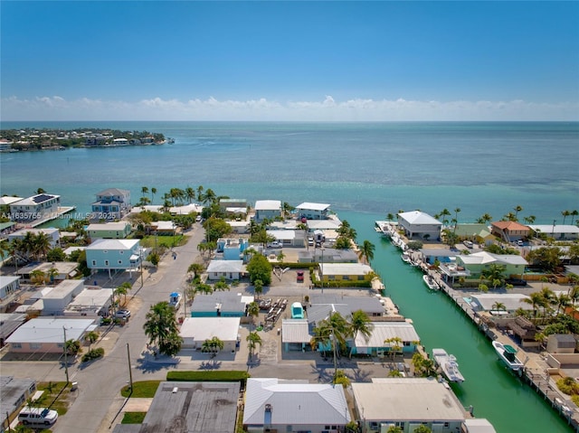 bird's eye view with a water view and a residential view