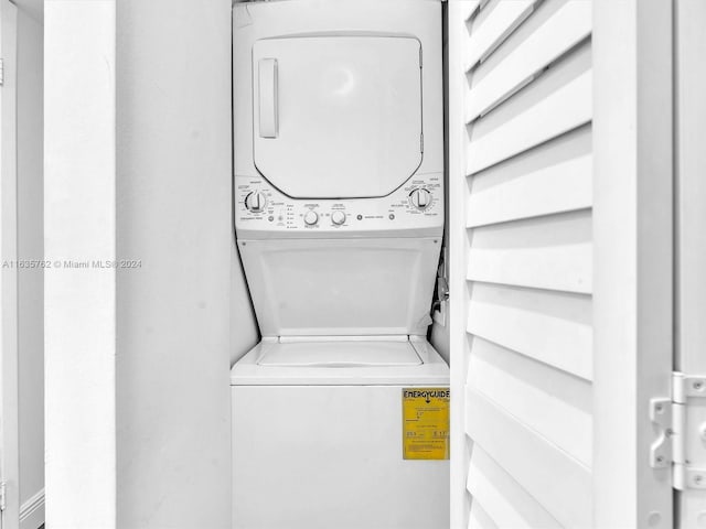 washroom with laundry area and stacked washing maching and dryer