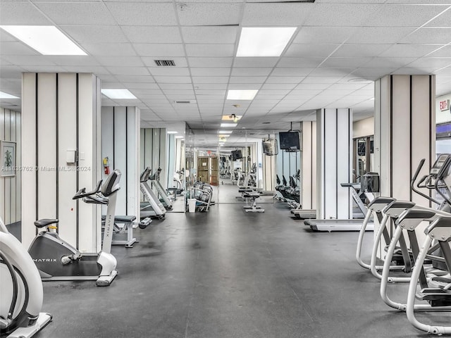 exercise room with a drop ceiling