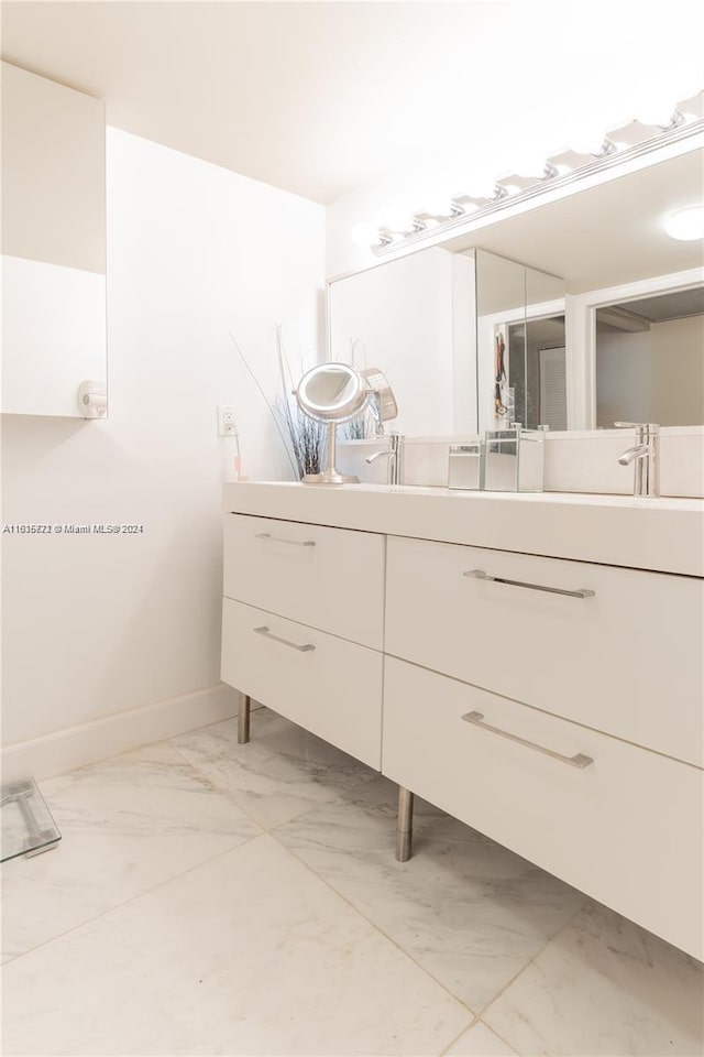 bathroom featuring tile patterned floors and vanity