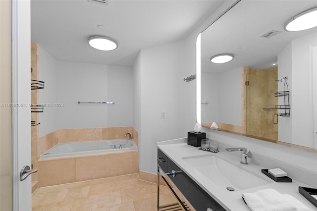 bathroom with vanity, tile patterned floors, and separate shower and tub