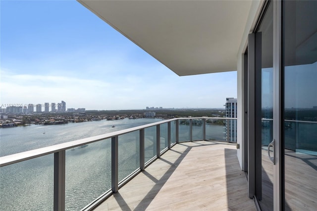 balcony featuring a water view