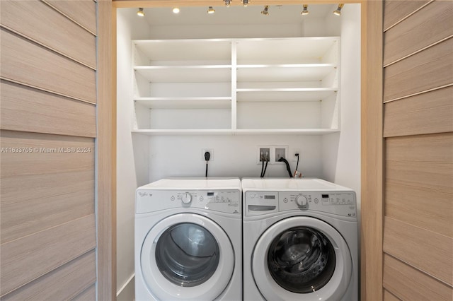 clothes washing area featuring laundry area and independent washer and dryer