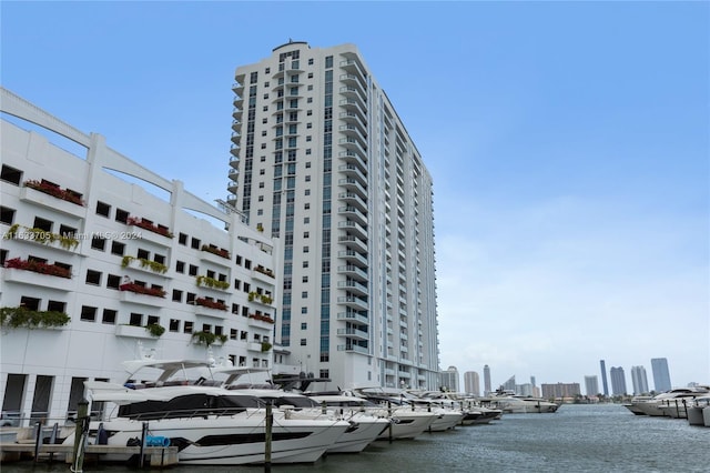 view of property featuring a view of city and a water view