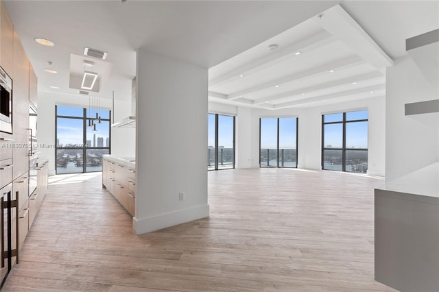 interior space with recessed lighting, baseboards, visible vents, and light wood finished floors