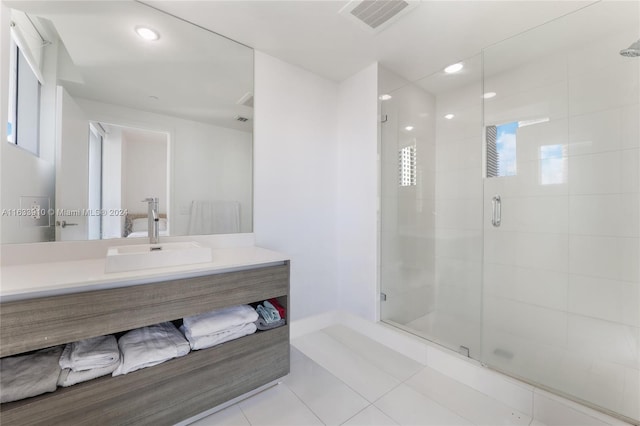 bathroom featuring a stall shower, tile patterned flooring, visible vents, and vanity