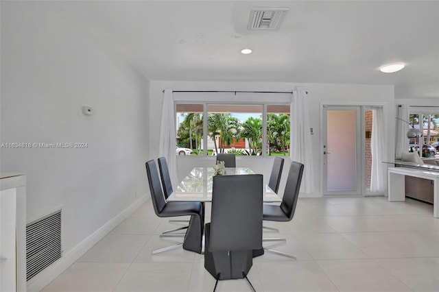 dining space with light tile patterned floors