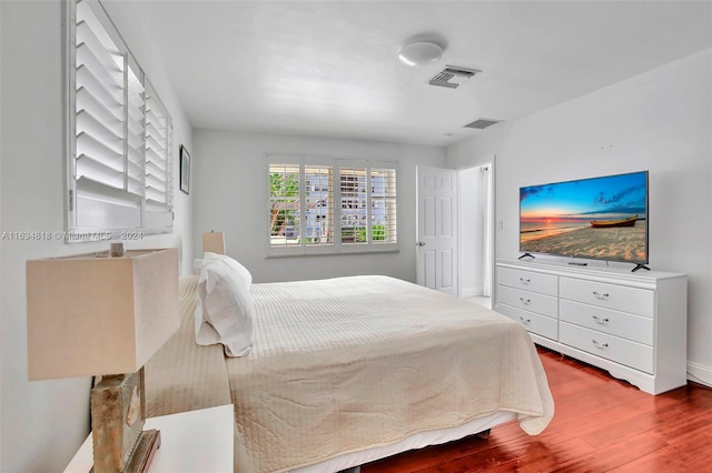 bedroom with wood-type flooring