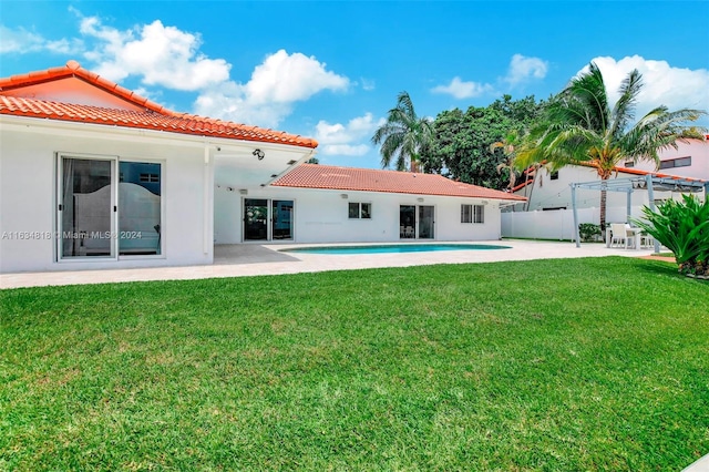 exterior space with a patio area and a yard