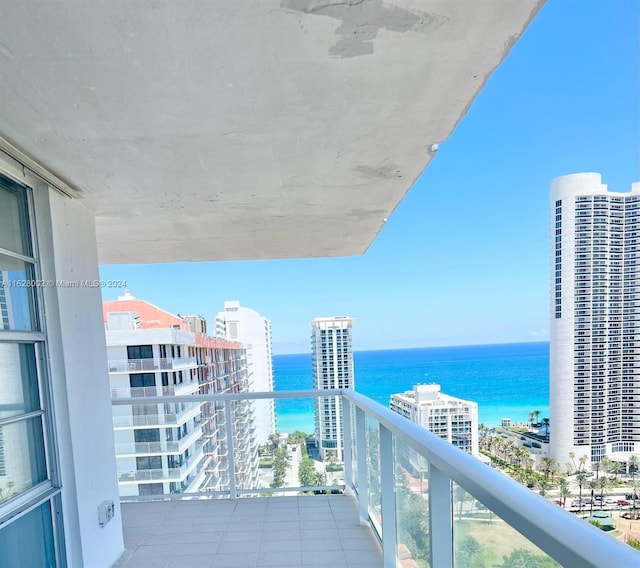 balcony featuring a water view