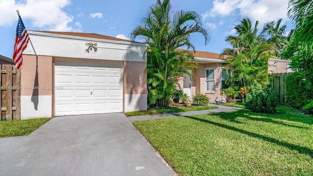 view of front of property with a garage and a front yard