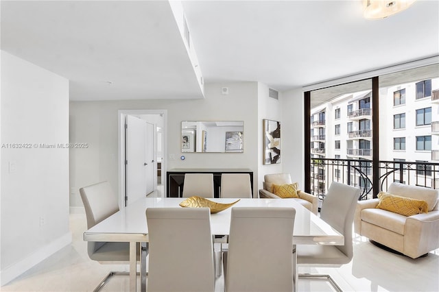 dining area with a wall of windows