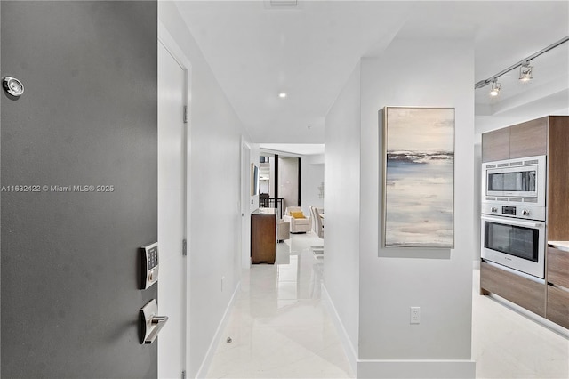 hallway with light tile patterned flooring