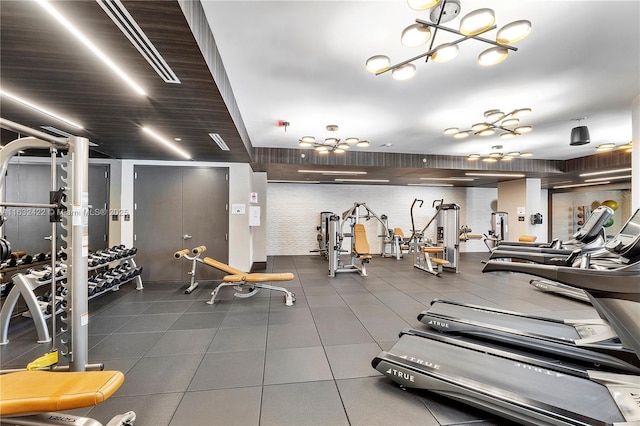 workout area with a chandelier