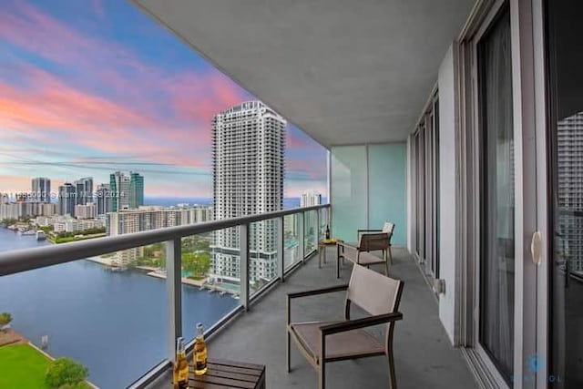 balcony at dusk with a water view