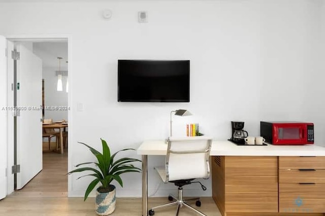 home office featuring light hardwood / wood-style floors