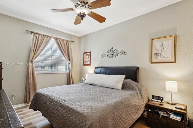 bedroom featuring ceiling fan and wood finished floors